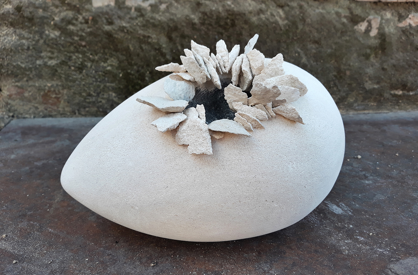 Sculpture in stone on the thema Egg by Emanuela Camacci